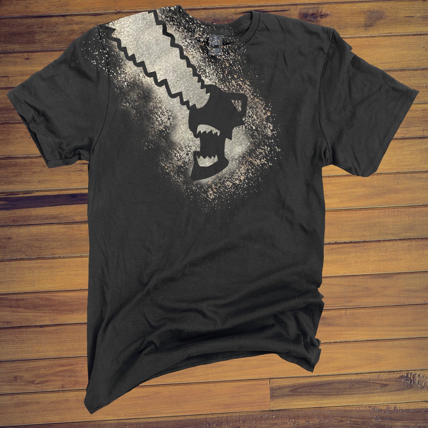 Black T Shirt with Chainsaw Man design across the front and shoulder made with bleach