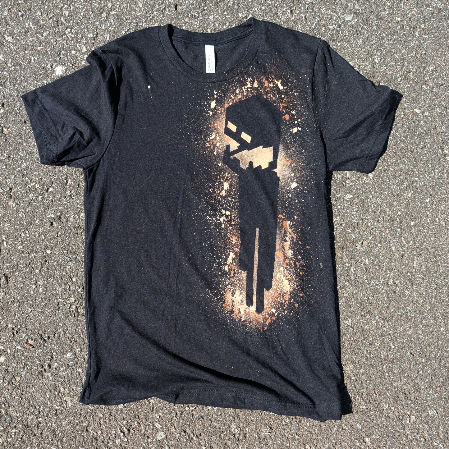 a black tee shirt with a Minecraft Enderman logo made with bleach