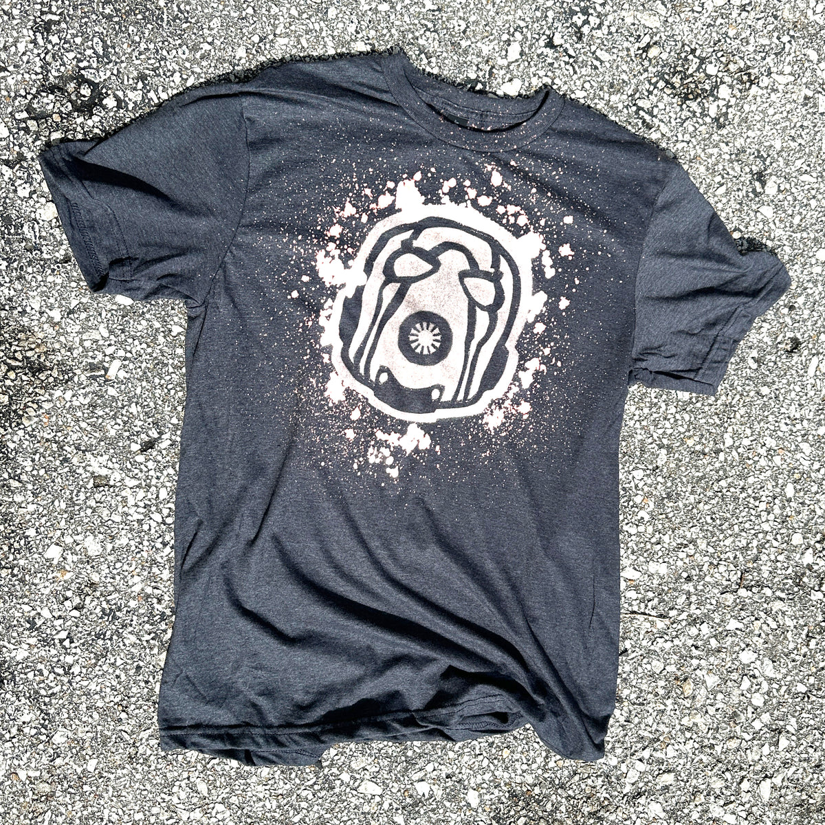 A charcoal gray shirt with a Psycho design from Borderlands made with bleach
