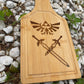 Medium size cutting board with Zelda Hyrule emblem and Master Sword