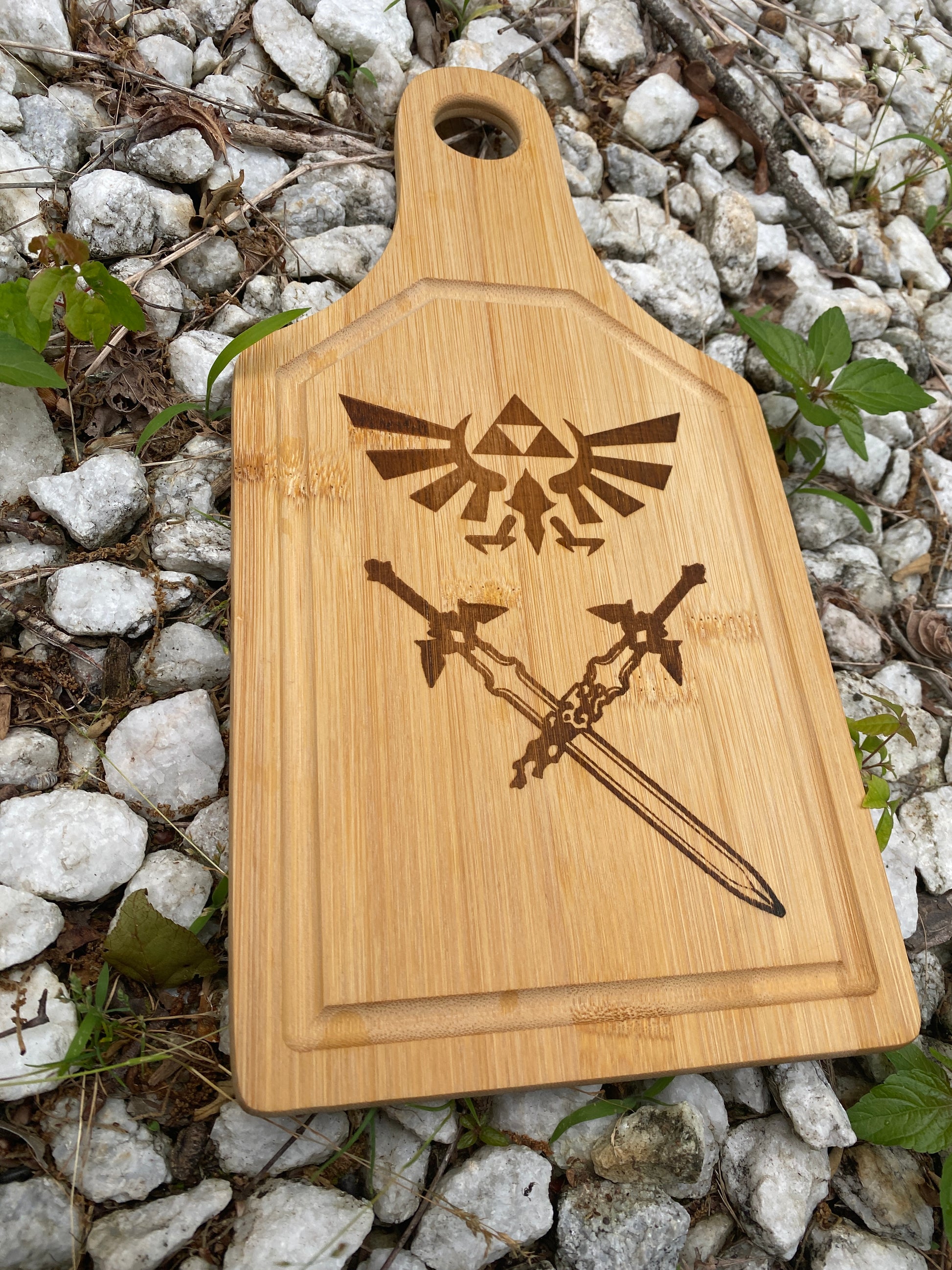 Medium size cutting board with Zelda Hyrule emblem and Master Sword